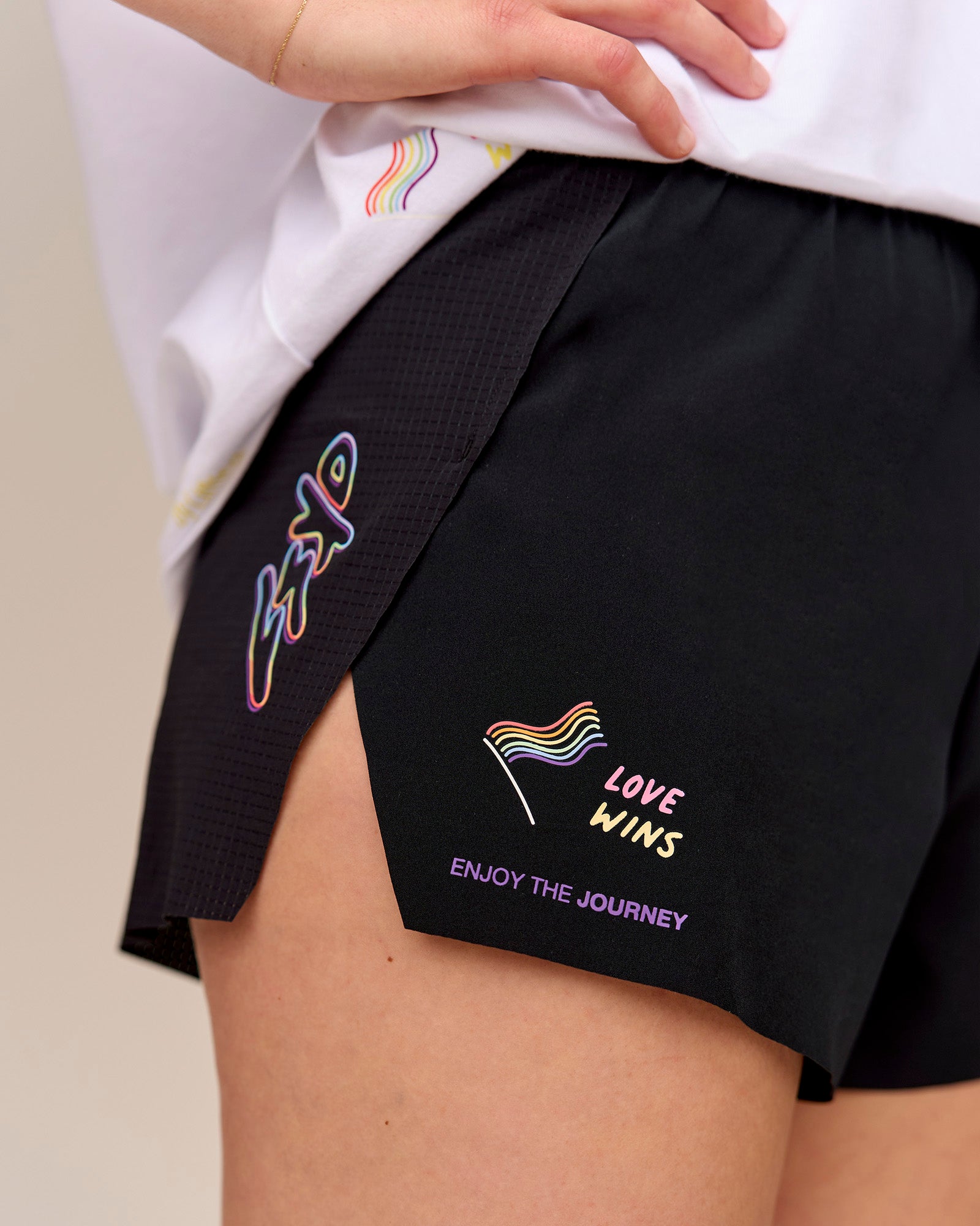 Woman wearing Accelerate 3" High-Rise Running Short - Black-Radiate 