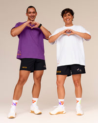 Man wearing Pride Sticker Boxy Tee - White | Thumbnail Index: 8