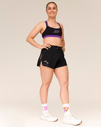 Woman wearing Velocity Graphic Sports Bra - Black-Radiate | Thumbnail Index: 2