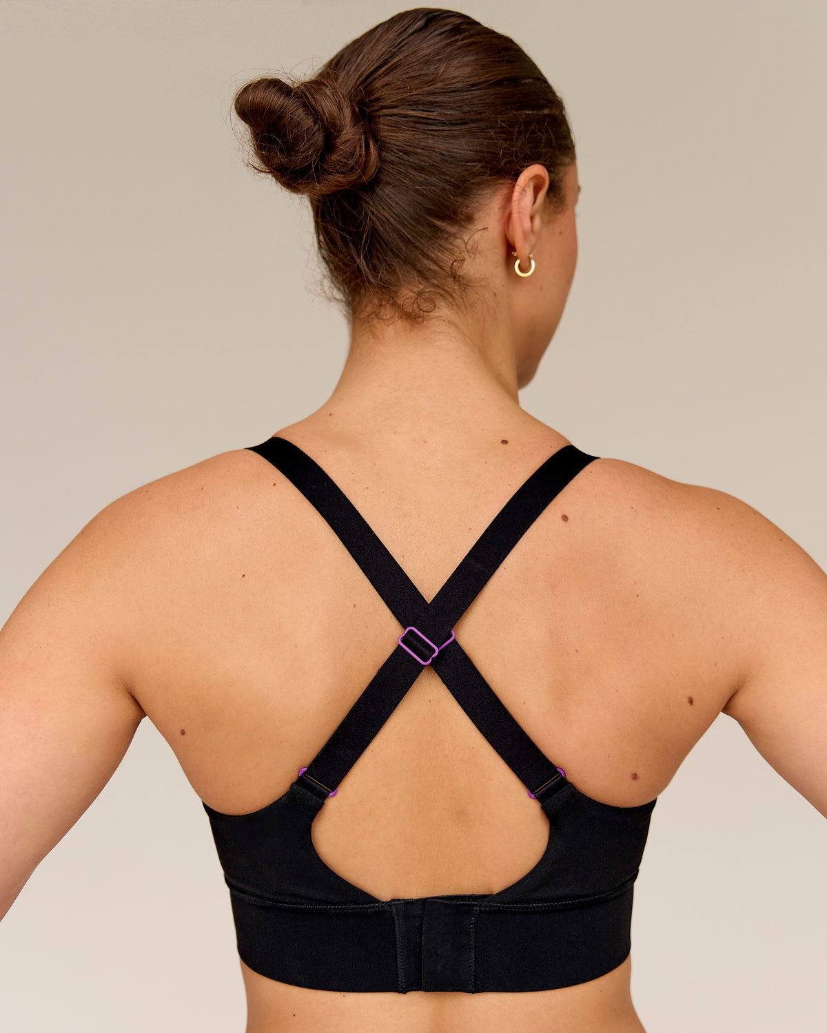Woman wearing Accelerate Graphic Sports Bra - Black-Radiate