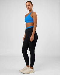 Woman wearing Liberate High-Rise Full Length Legging Pockets - Black-Palace Blue | Model:Brylee | Size:XS | Thumbnail Index: 2
