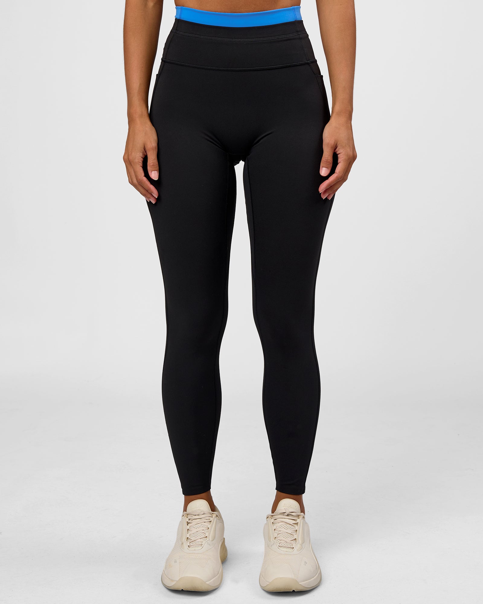 Woman wearing Liberate High-Rise Full Length Legging Pockets - Black-Palace Blue | Model:Brylee | Size:XS