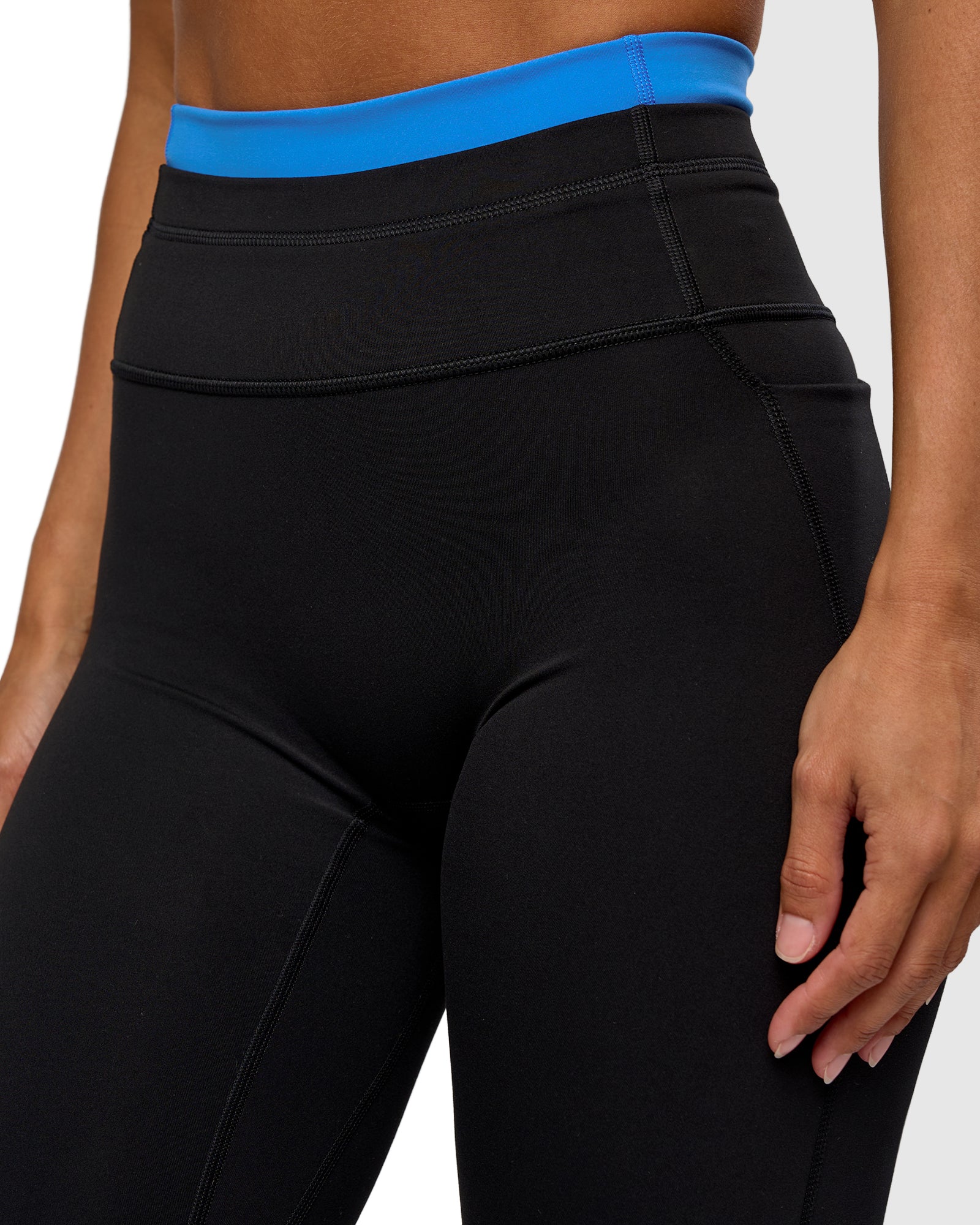 Woman wearing Liberate High-Rise Full Length Legging Pockets - Black-Palace Blue | Model:Brylee | Size:XS