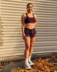 Woman wearing Accelerate 3" Mid-Rise Running Short - Cherry Lacquer | Thumbnail Index: 1