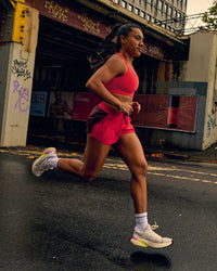 Woman wearing Accelerate 3" Mid-Rise Running Short - Cherry Lacquer-Scarlet | Thumbnail Index: 9