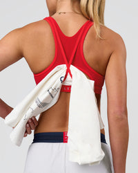 Woman wearing Unstoppable Racerback Sports Bra - Scarlet | Model:Issy| Size:XS | Thumbnail Index: 1
