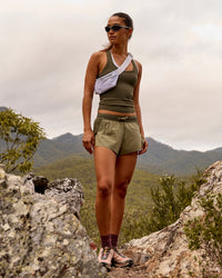Woman wearing Accelerate 3" Mid-Rise Running Short - Pure Olive-Fog | Thumbnail Index: 1