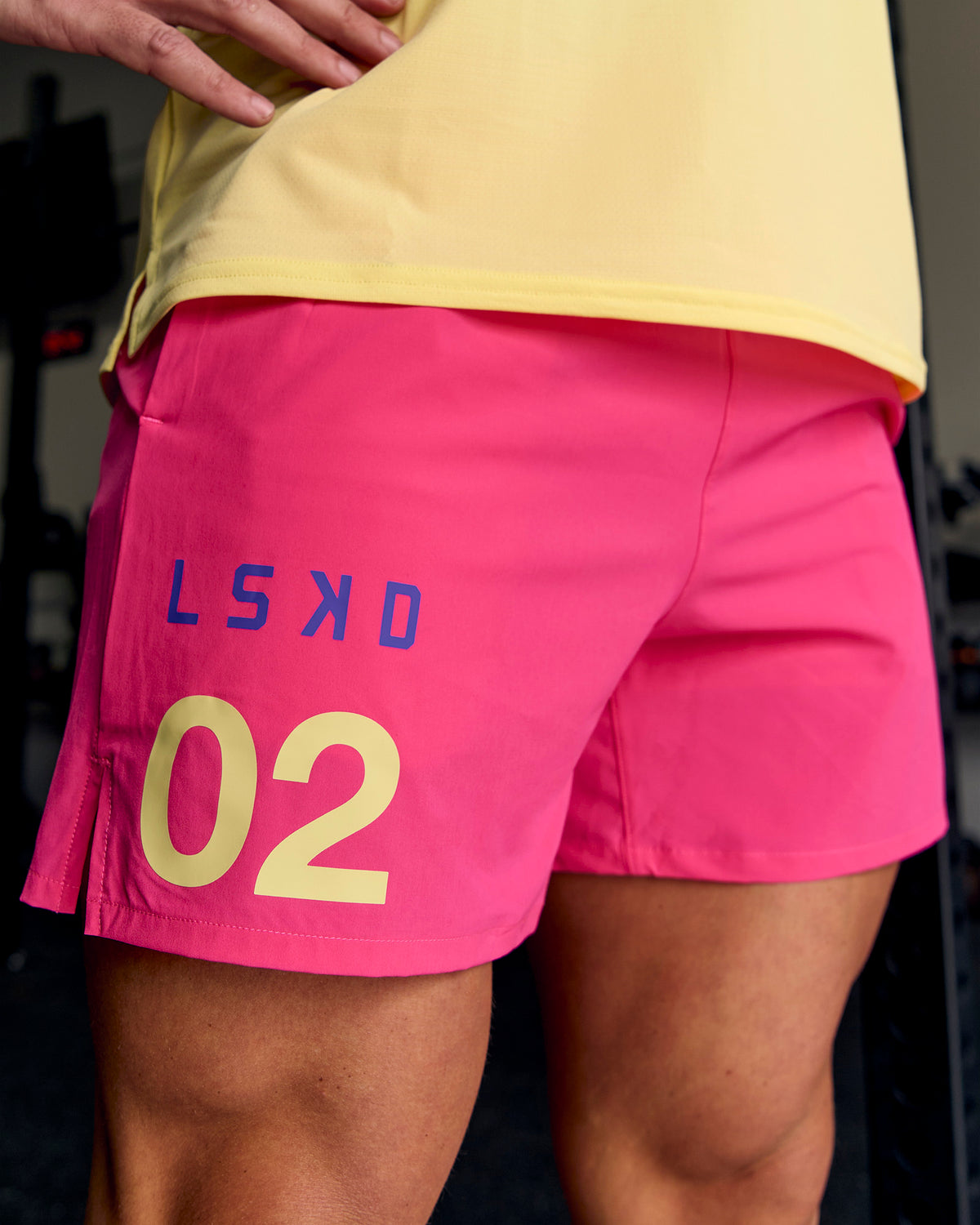 Man wearing Pace 5" Lined Running Short - Game Plan Ultra Pink