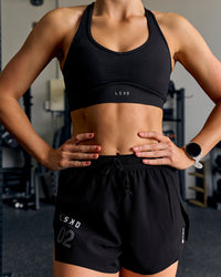 Woman wearing Stamina Amplify Sports Bra - Black | Thumbnail Index: 10