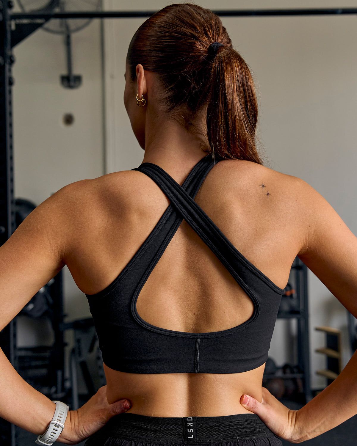 Woman wearing Stamina Amplify Sports Bra - Black