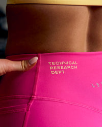 Woman wearing Fusion V-Contour High-Rise 6" Short Pockets - Ultra Pink-Tech Department | Thumbnail Index: 16