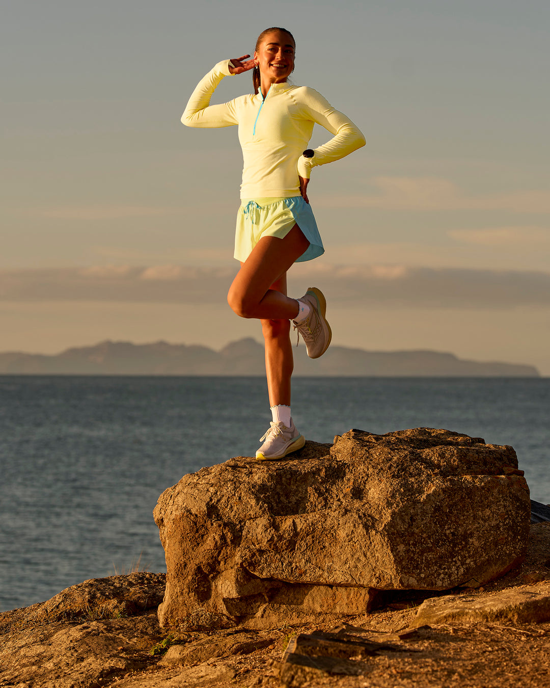 Woman wearing GG AeroFLX+ Long Sleeve Half Zip - Lemon-Baltic Sea | Model:Grace | Size:XS - view 12