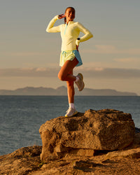 Woman wearing GG AeroFLX+ Long Sleeve Half Zip - Lemon-Baltic Sea | Model:Grace | Size:XS | Thumbnail Index: 11