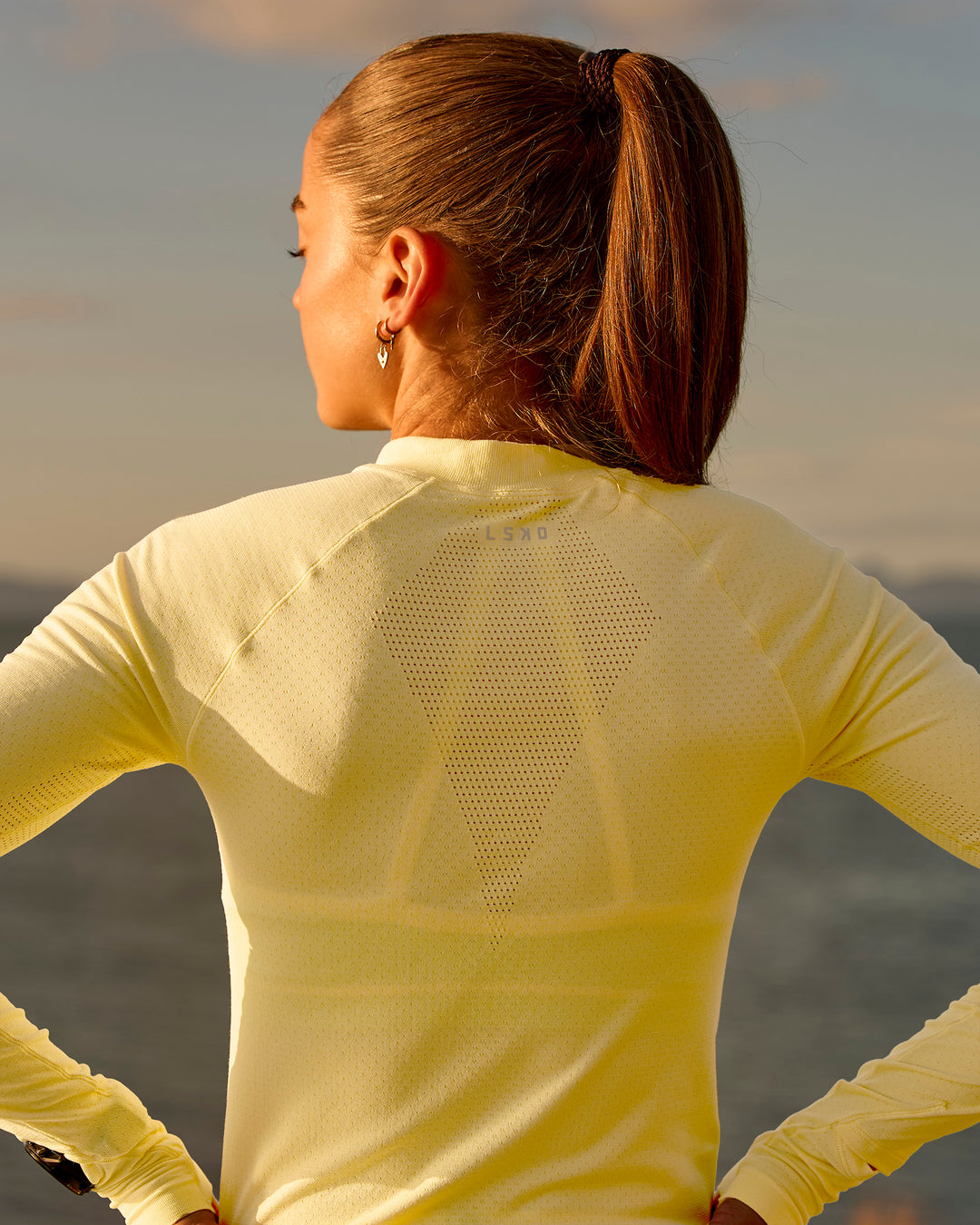 Woman wearing GG AeroFLX+ Long Sleeve Half Zip - Lemon-Baltic Sea | Model:Grace | Size:XS - view 11
