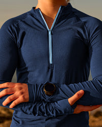 Woman wearing GG AeroFLX+ Long Sleeve Half Zip - Future Navy-Baltic Sea | Model:Grace | Size:XS | Thumbnail Index: 0