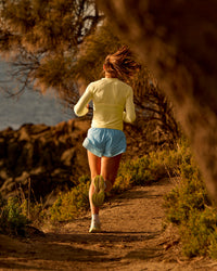 Woman wearing GG AeroFLX+ Long Sleeve Half Zip - Lemon-Baltic Sea | Model:Grace | Size:XS | Thumbnail Index: 2