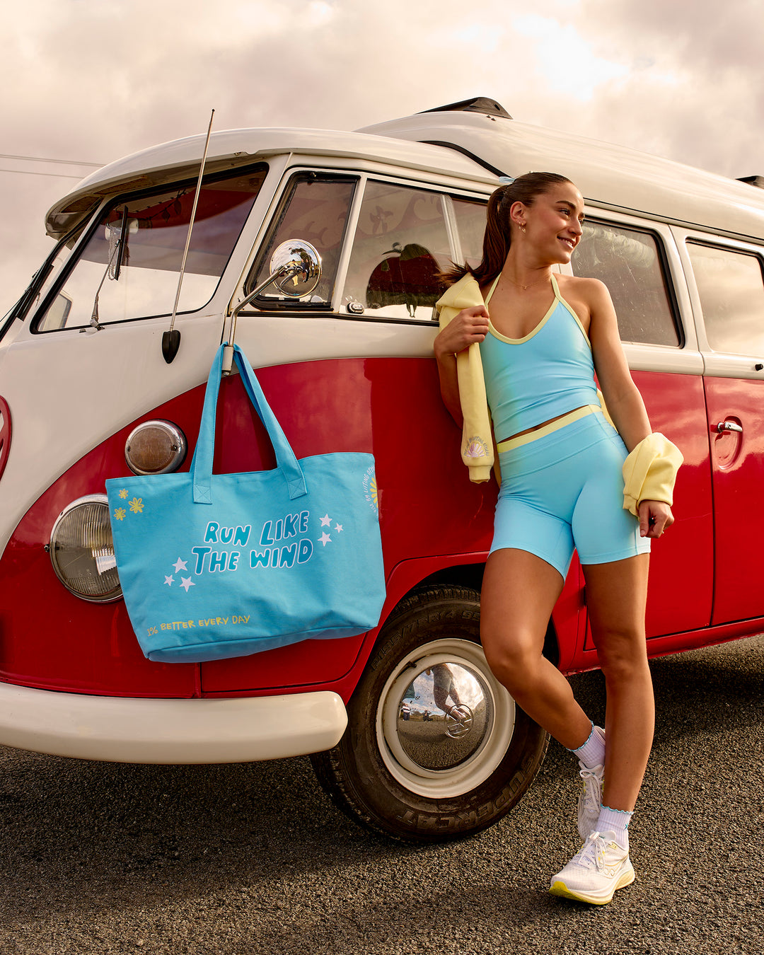 Woman wearing Lume Fusion Mid-Rise V Contour 6" Short Pockets - Baltic Sea-Lemon | Model:Grace | Size:XS - view 8