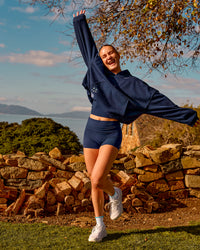 Woman wearing Groovy High Rise Fold Over 4" Short - Future Navy | Model:Brianna | Size:XS | Thumbnail Index: 2