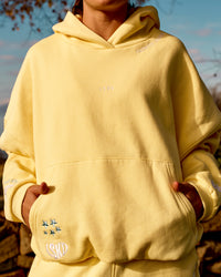 Woman wearing Zola Oversized Hoodie - Lemon | Model:Grace | Size:M | Thumbnail Index: 1