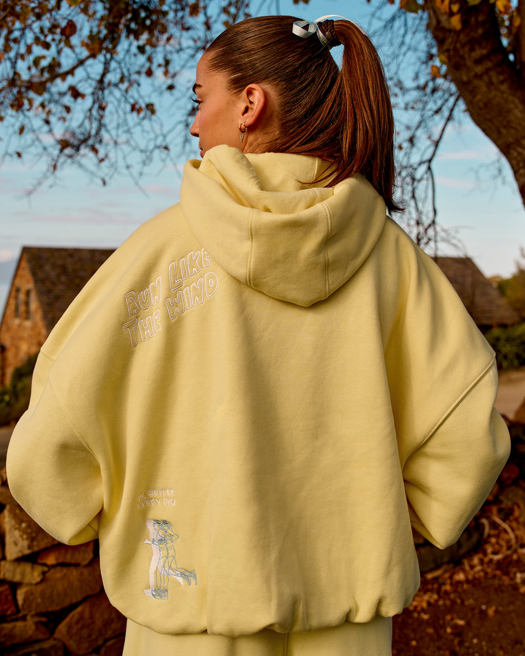 Woman wearing Zola Oversized Hoodie - Lemon | Model:Grace | Size:M - view 1
