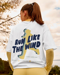 Woman wearing Woman wearing Run Like The Wind FLXCotton Oversized Tee - White-Future Navy | Model:Grace | Size:S | Thumbnail Index: 0