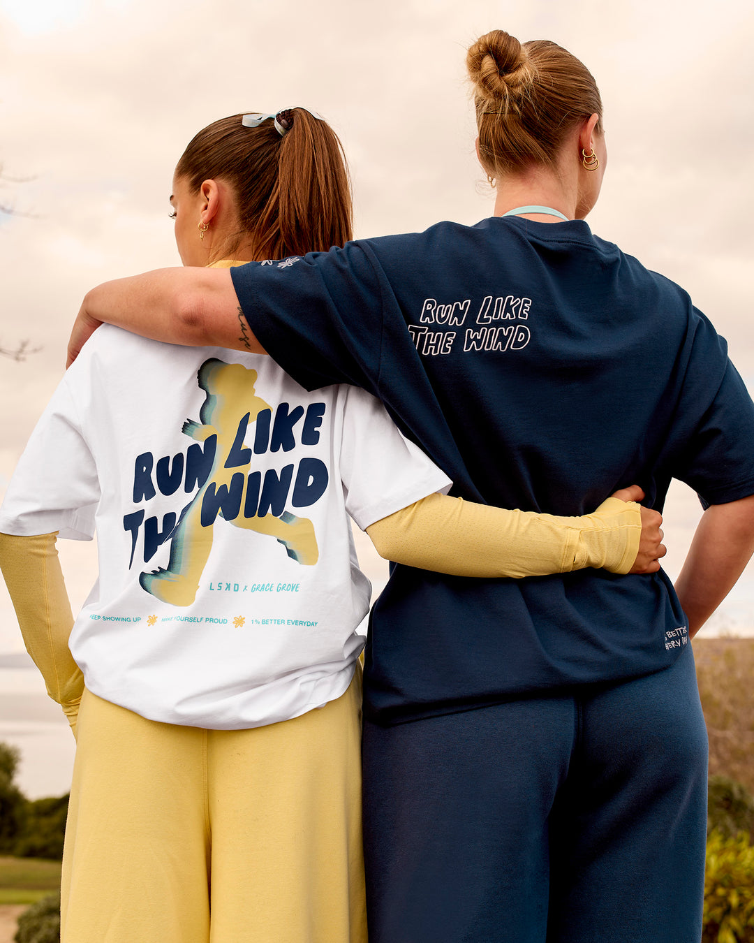Woman wearing Run Like The Wind FLXCotton Oversized Tee - White-Future Navy | Model:Grace | Size:S - view 11