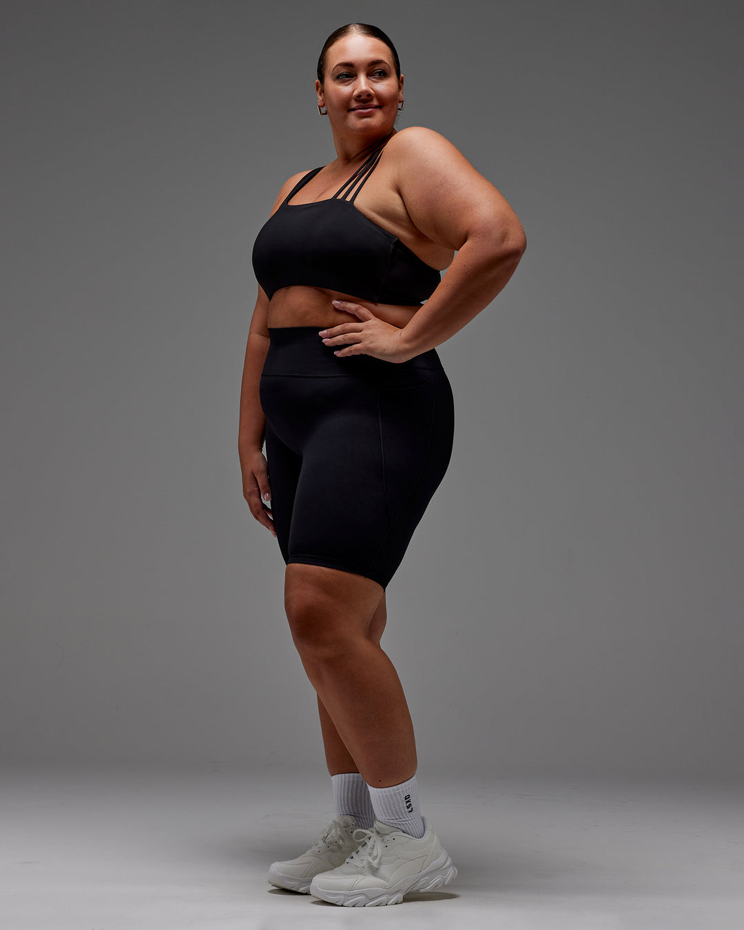 Woman wearing Fusion Ultra High-Rise 9" Short Pockets - Black | Model:Jordie | Size:2XL - view 11