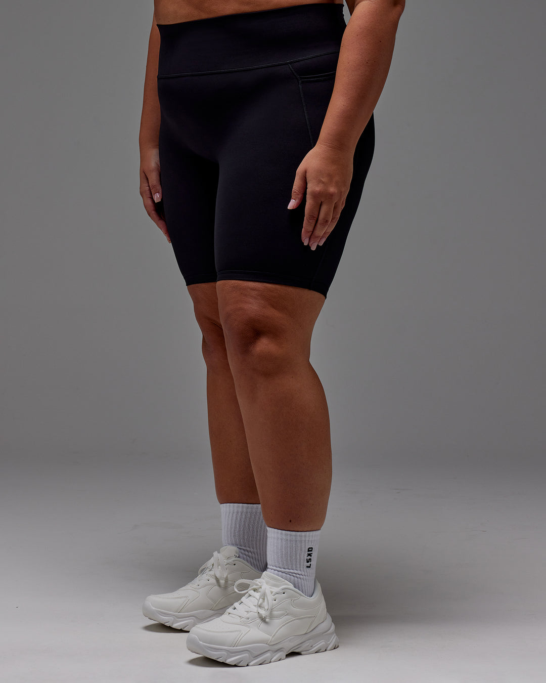 Woman wearing Fusion Ultra High-Rise 9" Short Pockets - Black | Model:Jordie | Size:2XL - view 9