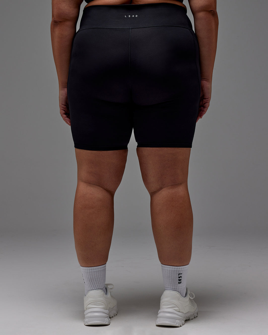 Woman wearing Fusion Ultra High-Rise 9" Short Pockets - Black | Model:Jordie | Size:2XL - view 12