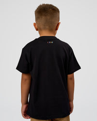 Kid wearing Kid wearing Kids Enjoy the Journey FLXCotton Tee - Bubblegum | Model:Jax | Size:6 | Thumbnail Index: 6
