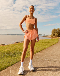 Woman wearing Accelerate 3" Running Short - Cantaloupe | Model:  | Size: | Thumbnail Index: 11