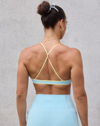 Woman wearing Ambience Sports Bra - Crystal Blue-Lemon | Thumbnail Index: 1