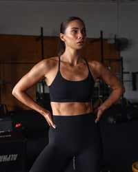 Woman wearing Bonded Sports Bra - Black | Thumbnail Index: 0