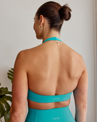 Woman wearing Challenger Sports Bra - Uplift Blue | Thumbnail Index: 1