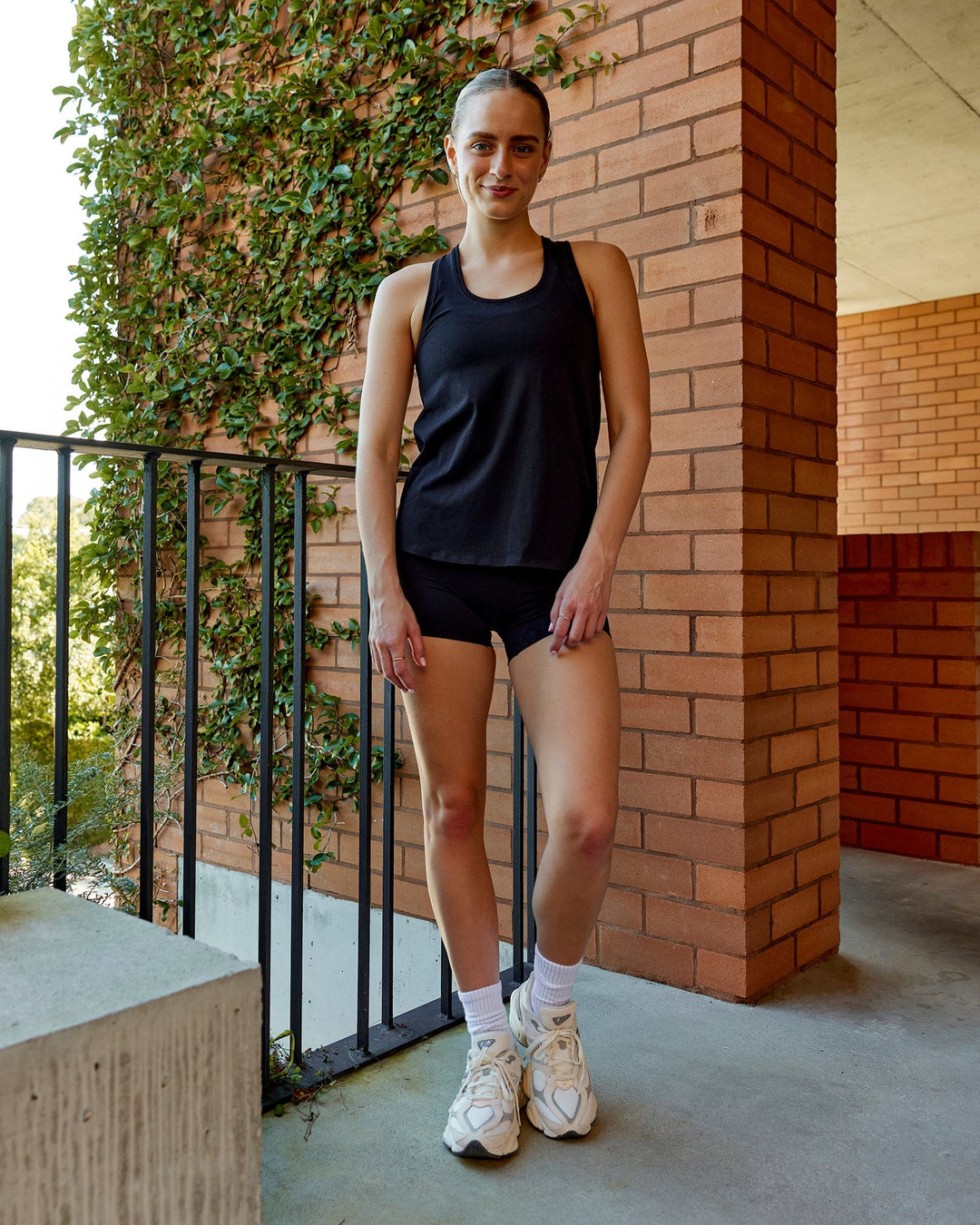 Woman wearing Charge PimaFLX-Lite Active Tank - Black - view 5