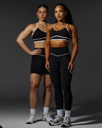 Woman wearing Contrast Sports Bra - Black-White | Thumbnail Index: 0