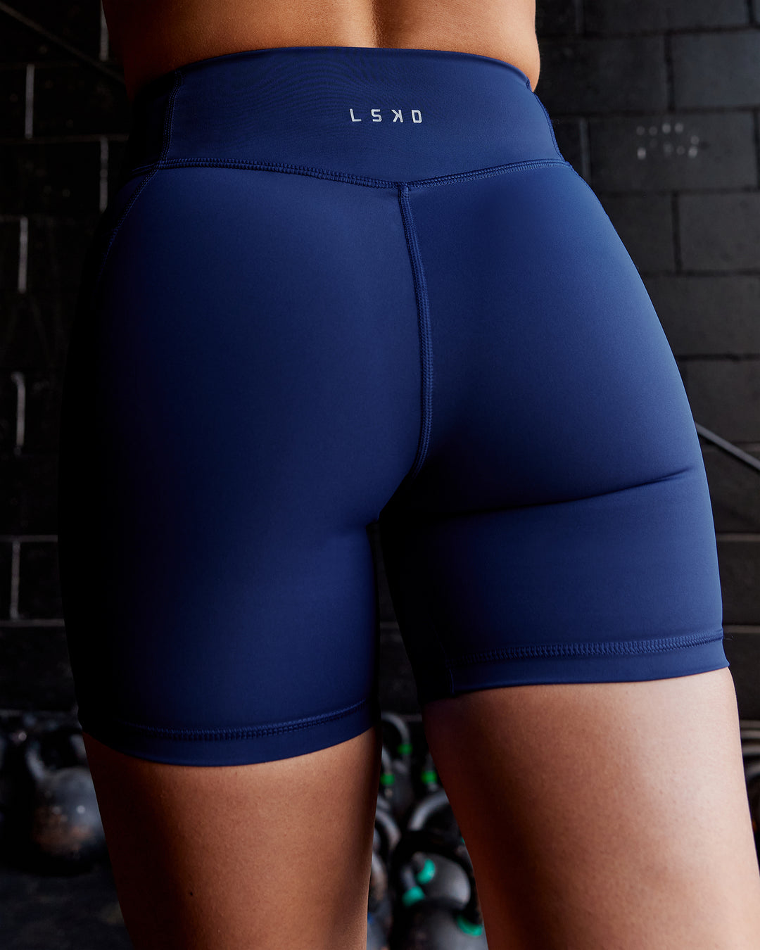 Woman wearing Elite High-Rise 6" Short Pockets - Midnight Blue - view 3