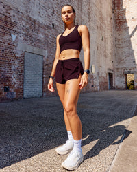 Woman wearing Evoke Sports Bra - Mulberry | Thumbnail Index: 2
