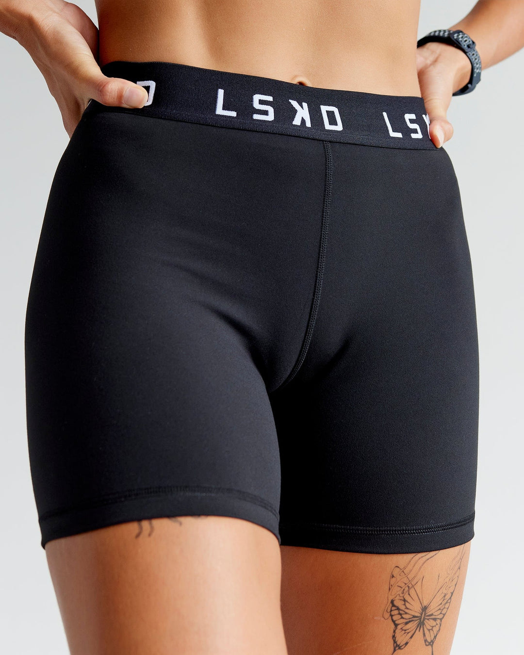 Woman wearing Extend Mid-Rise 6" Short - Black-White - view 3