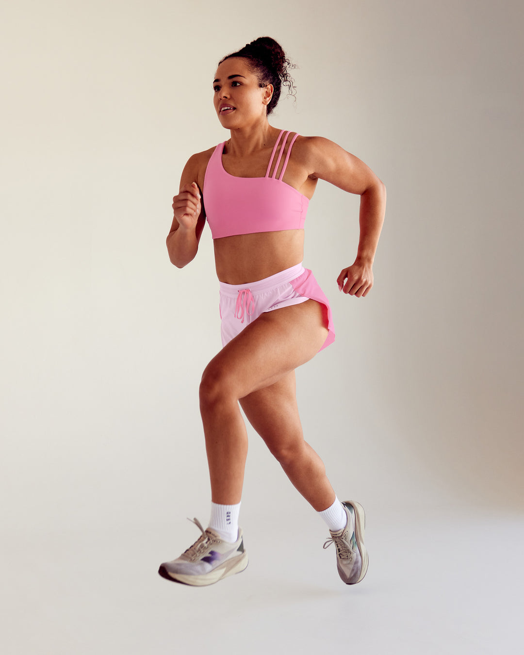 Woman wearing Galvanise Sports Bra 2.0 - Candy Pink - view 1