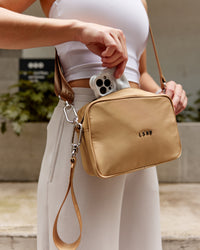 Woman wearing Go-To Shoulder Bag - Oat Milk | Thumbnail Index: 1