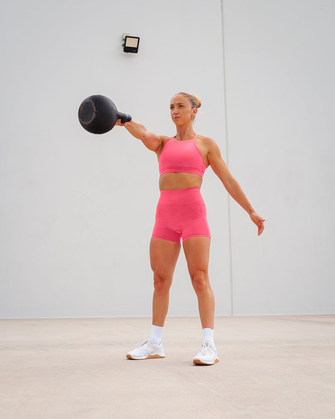 Woman wearing Lift High Neck Sports Bra - Hot Pink - view 3