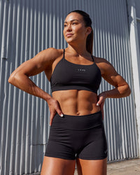 Woman wearing Lift Sports Bra - Black | Thumbnail Index: 2