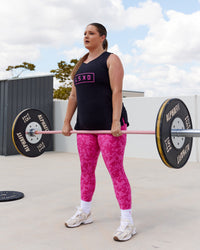 Woman wearing Luna FLXCotton Longline Tank - Black-Ultra Pink | Thumbnail Index: 3