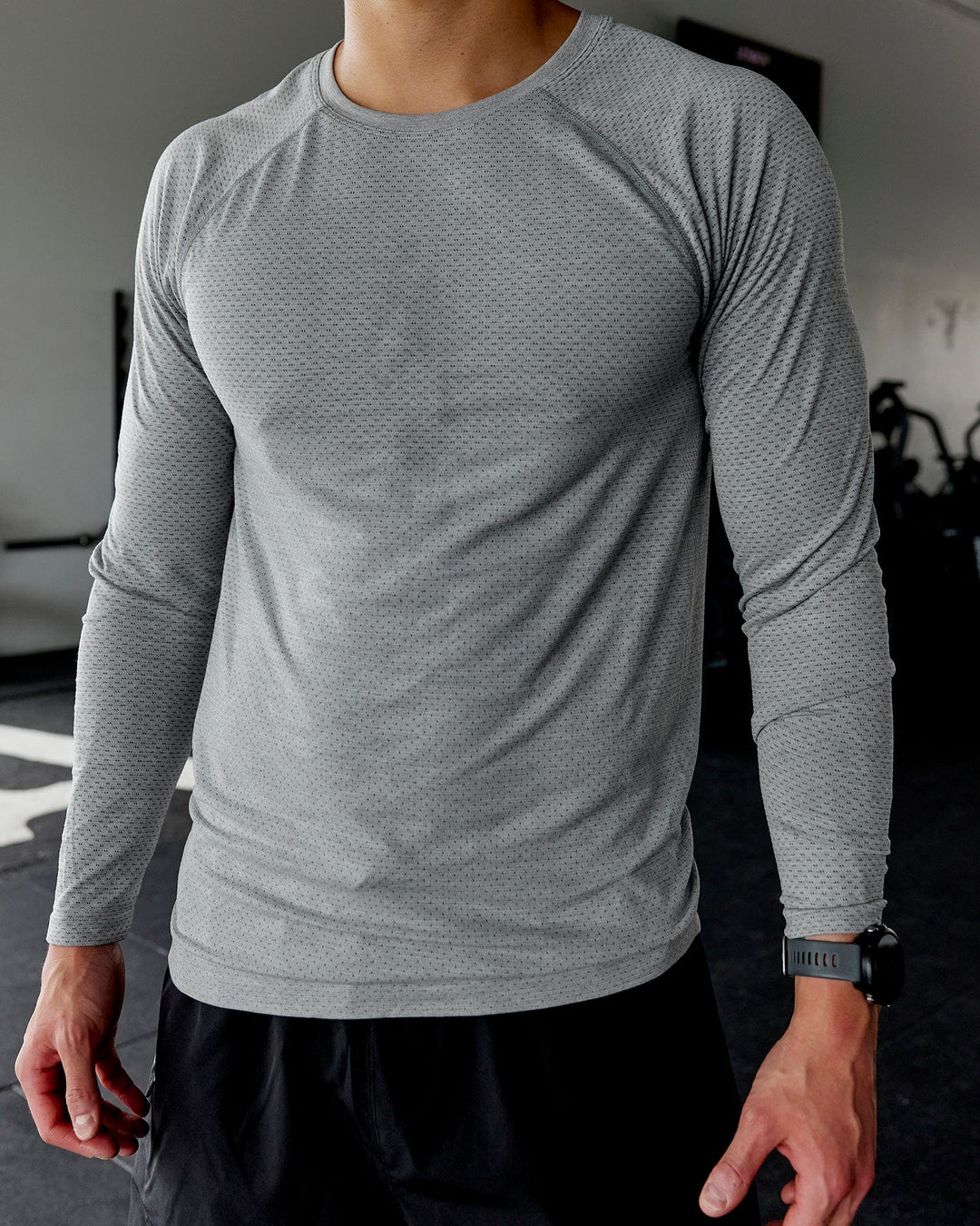 Man wearing AeroFLX+ Seamless Long Sleeve Tee - Light Grey Marl - view 4