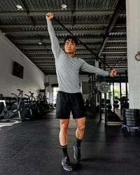 Man wearing AeroFLX+ Seamless Long Sleeve Tee - Light Grey Marl | Thumbnail Index: 0