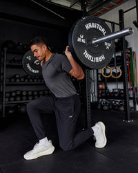 Man wearing AeroFLX+ Seamless Tee - Pirate Black Marl | Thumbnail Index: 0