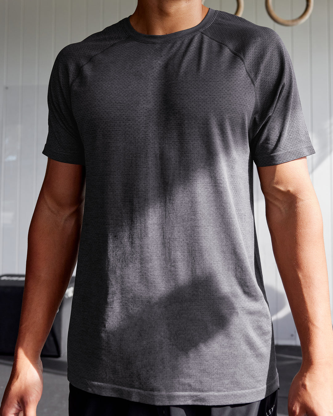 Man wearing AeroFLX+ Seamless Tee - Pirate Black Marl - view 5