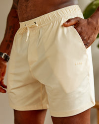 Man wearing Restore 6" CloudFLX Shorts - Ivory | Thumbnail Index: 3
