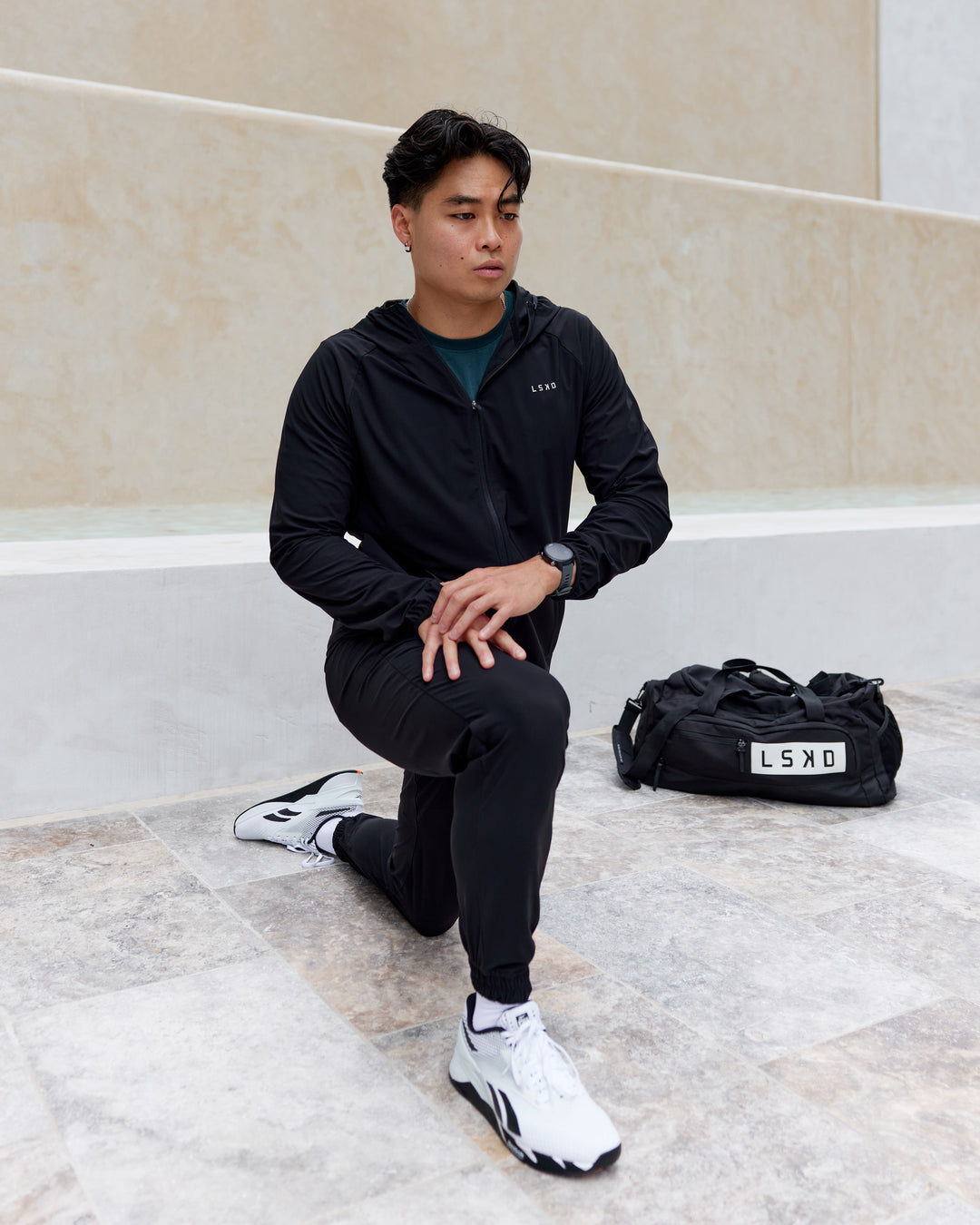 Man wearing Train-Lite FLXMAX Jacket - Black - view 4